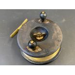 A Millwards wood and brass cross back 6" centre pin fishing reel.