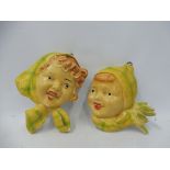 Two 1950s plaster wall plaques of children.
