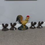 A vintage cast iron Doorstop, modelled as a Cockerel, together with four further, also modelled as