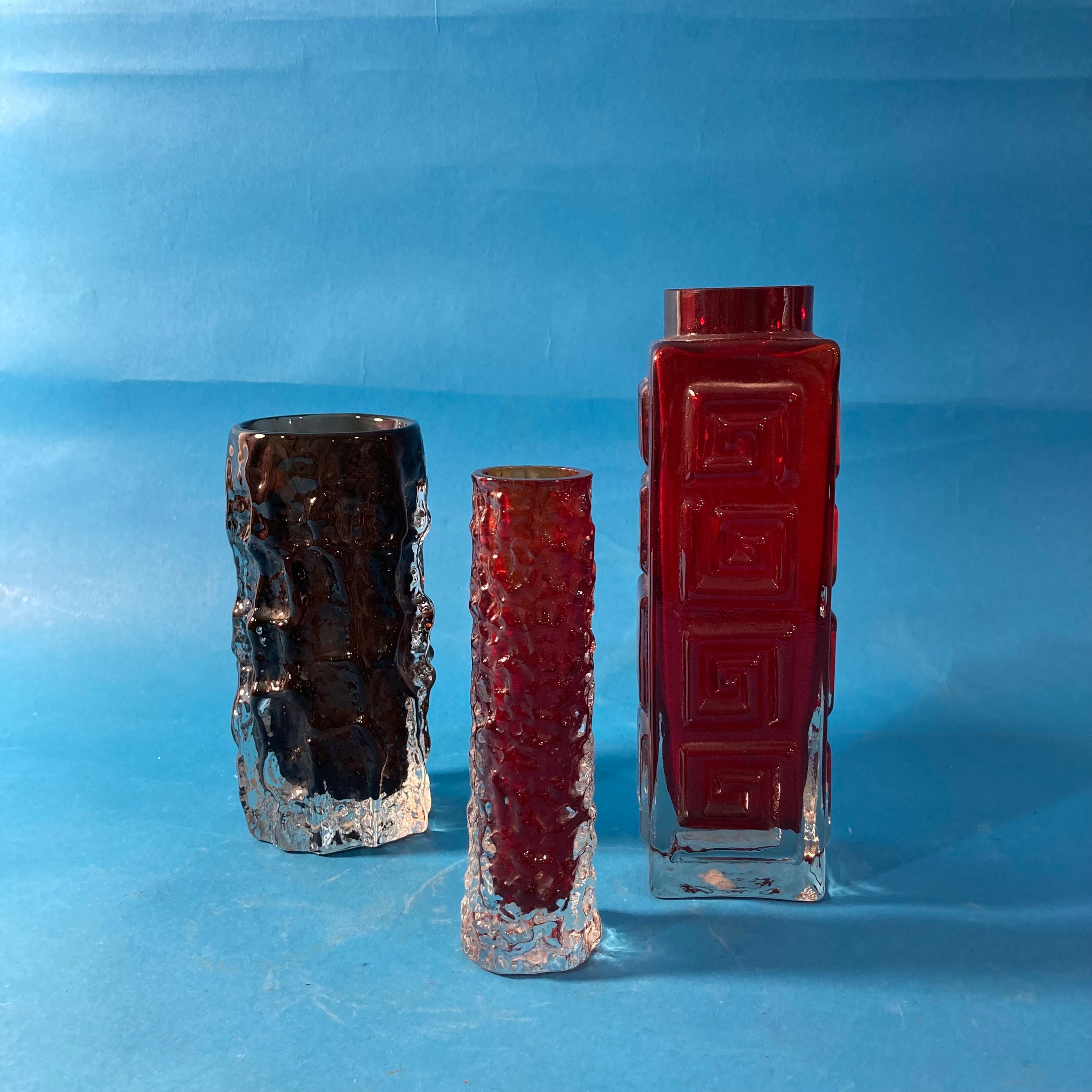 A Geoffrey Baxter for Whitefriars 'Greek Key' pattern glass Vase, in Ruby Red, 20cm tall, together