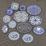 A large quantity of antique Meat Plates, decorated in the blue and white palette, to include