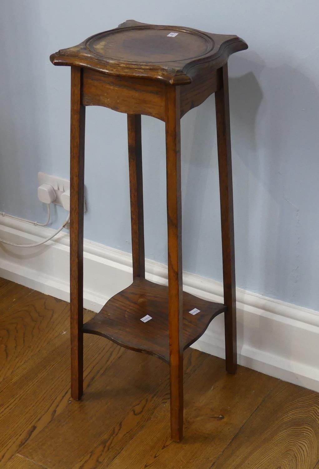 An Arts and Crafts oak Torchere/Plant Stand, with an under tier, some water damage, 39cm wide x 39cm