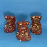 Three antique Chinese pottery Kylins, all holding a smaller Kylin, all damaged, 27cm tall (3)