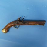 A late 18th century Officer's flintlock holster Pistol, with brass mounts and brass topped wooden