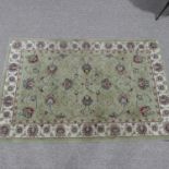 A modern, good quality wool pile pale green machine-made Hearth Rug, 102cm x 160cm.