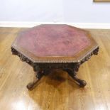 A Victorian heavily carved oak octagonal Drum Table, with octagonal skived in tooled leather top