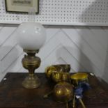 A set of three vintage hanging Scales, the brass bodies with brass bowls, together with a vintage