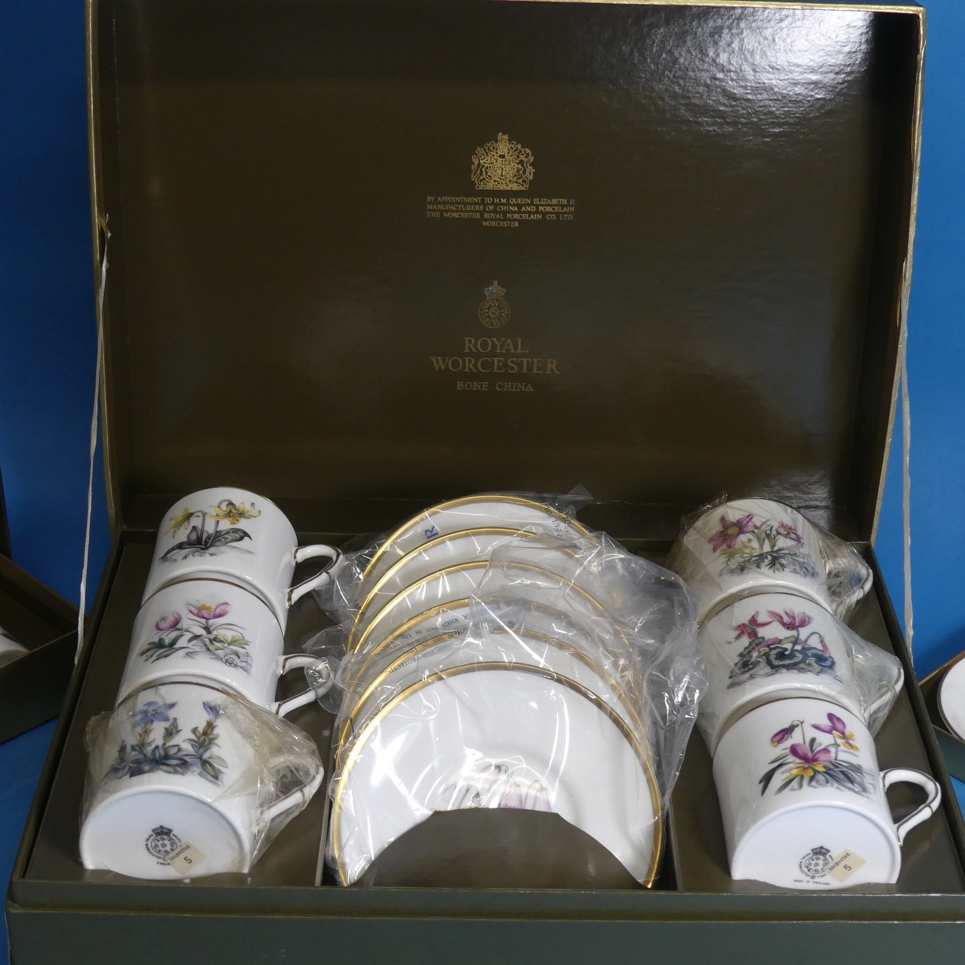 A cased Royal Worcester Coffee Set, decorated in various species of flora, six place setting,