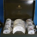 A cased Royal Worcester Coffee Set, decorated in various species of flora, six place setting,