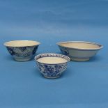 An antique Chinese blue and white Tea Bowl, decorated underglaze with flora, together with two