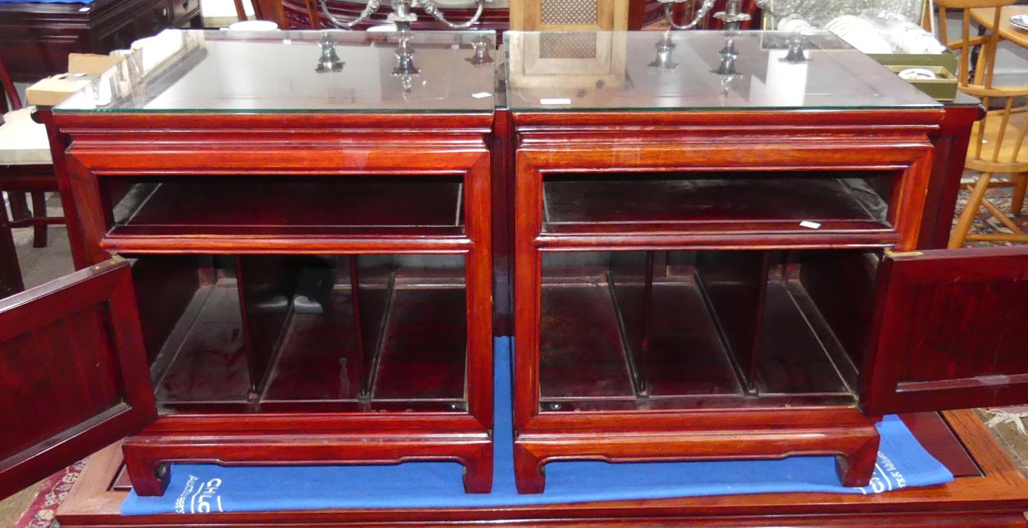 A pair of late 20thC Oriental hardwood Bedside Cabinets, with a single open shelf above a cupboard - Image 2 of 3