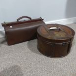 A vintage leather Hat Box, 36cm diameter, together with a vintage leather Gladstone Bag (2)