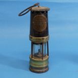 An antique brass and iron Miners Lamp by Hailwood & Ackroyd Ltd Leeds, the brass plaque