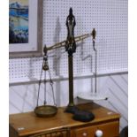 A set of antique Scales by Widdowson Stockport, W 72cm x H 86cm x D 37cm, together with a set of