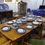 An early 20thC Staffordshire Dinner Service, decorated in blue banding with gilding, comprising five