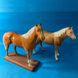 A Beswick pottery Horse, mounted on a plinth, factory stamp to base, has been mounted amateurly,