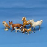 A small quantity of Beswick Pottery, to include two horses, a fox, a hound, an owl, a calf and a