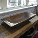 An antique rustic dug-out Dough Bin, the exterior stained with remnants of green paint, metal straps