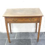 An 19thC mahogany bow-front Side Table, with central frieze drawer, raised on square tapering