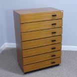 A retro Chest of Drawers, comprising sevon drawers of identical size with asymmetric design, W