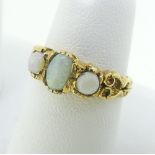 A small three stone opal Ring, mounted in 9ct yellow gold, Size L, approx total weight 2.3g.