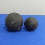 Two antique Cannon Balls, possibly 16thC, retrieved by fishermen from Lyme Regis bay, larger 14cm