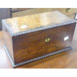 A Georgian rosewood Tea Caddy, moulded edges, interior with twin lidded compartments, working lock