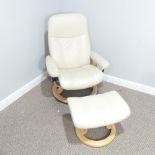 An Ekornes 'Stressless' cream easy Chair, with corresponding footstool, raised on swivel base,