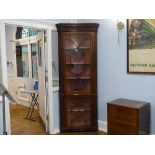 An early 20thC mahogany Floor Standing Corner Cupboard, the astragal glazed cupboards with shelved