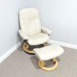 An Ekornes 'Stressless' cream easy Chair, with matching footstool, raised on swivel base, Chair: