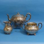A 19thC silver plated three piece Tea Set, of circular form with elaborate foliate decoration, the