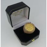 A George V gold half Sovereign, dated 1911, in 9ct gold ring mount with pierced decoration, ring