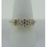 A diamond cluster Ring, formed of three graduated clusters of seven small diamonds, all mounted in