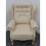 A modern cream leather wing-back Arm Chair, with button back cushion, W 77cm x H 107cm x D 66cm.