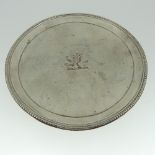 A George III silver Waiter, by Elizabeth Jones, hallmarked London, 1784, of plain circular form with