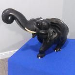 An early 20thC Indian carved Ebony Elephant, some repairs to back, W 68 cm x H 58cm.