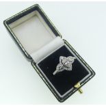 A diamond Dress Ring, the central marquise cut stone, approx. 0.45ct, with a marquise diamond on