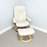 An Ekornes 'Stressless' cream easy Chair, with matching footstool, raised on swivel base, Chair: