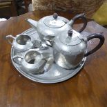 A W.& Co. Homeland pewter four-piece 'Hand' pattern Tea Service, together with an associated