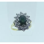 A green tourmaline and diamond Cluster Ring, the oval facetted tourmaline, approx 8mm long,