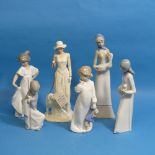 A Lladro Figure of a seat Girl with stick, together with two Nao figures and a further three similar