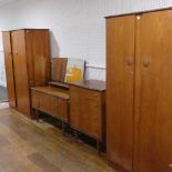 A vintage teak "Homeworthy" four piece Bedroom Suite - dressing table, chest of drawers and two