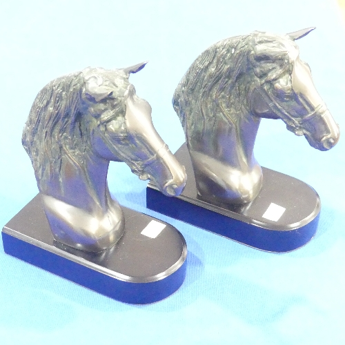 A pair of 20thC horse-bust Bookends, on fitted plinth, together with four brass pigs, of varying