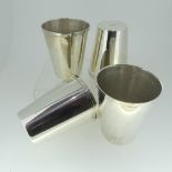A set of four graduated silver Beakers, of plain form, the bases marked 'Sil-Ver' and 'JBCo', approx