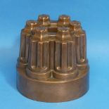 A Victorian copper Jelly Mould by Benham and Froud, with impressed mark to base, no. 285, 14cm