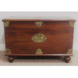 An Oriental brass bound hardwood Chest, with pierced brass work to exterior, the hinged lid