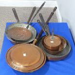 A collection of antique Copper and Brass ware, including sixteen horse-brasses, a brass oil lamp,