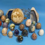 A collection of polished semi-precious stone Eggs and Spheres, including examples of Blue John,