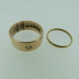 A wide 9ct rose gold Band, the front gypsy set with a small diamond point, Size S, approx total