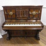 A late Victorian Collard and Collard upright rosewood piano, with brass candle sconces and hinged